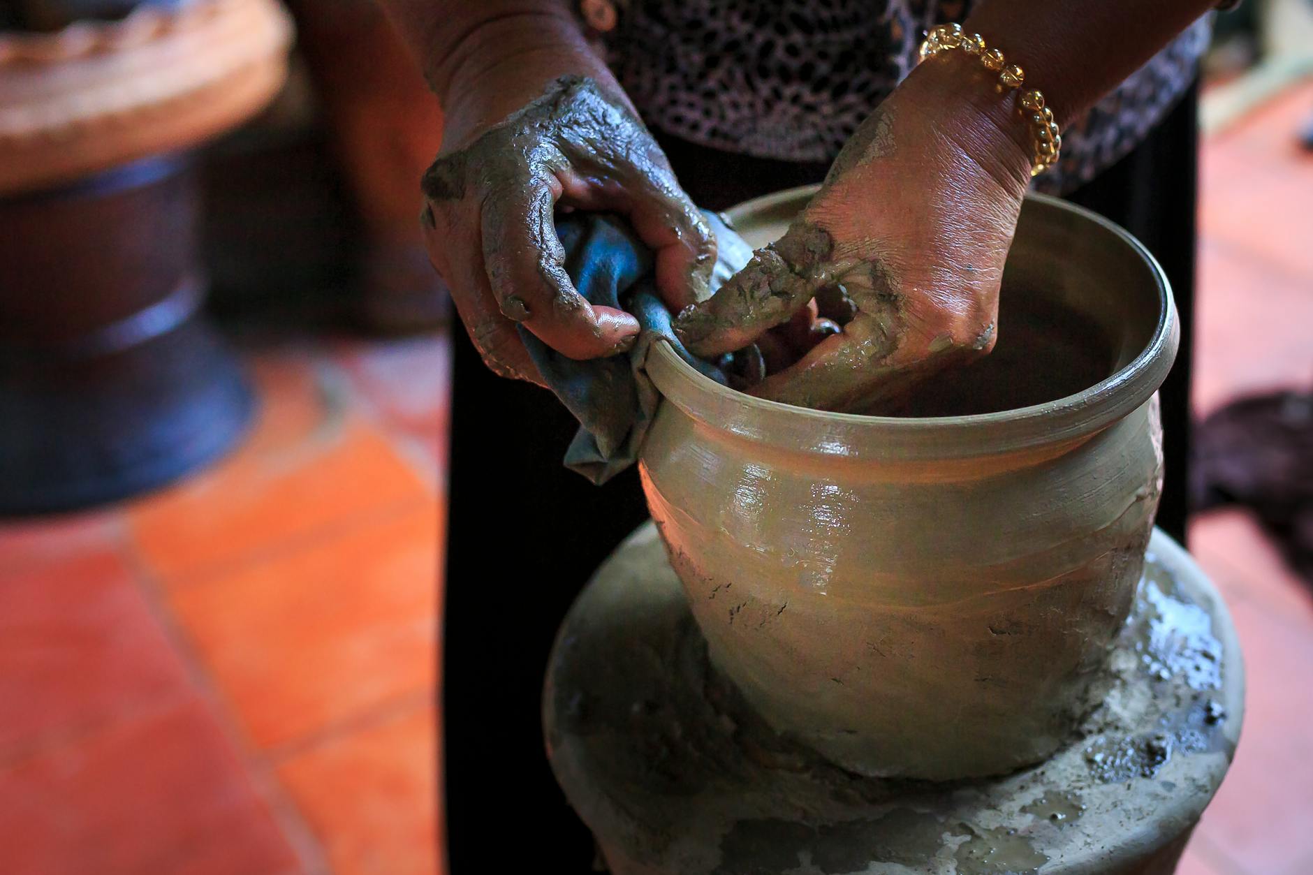person molding pot