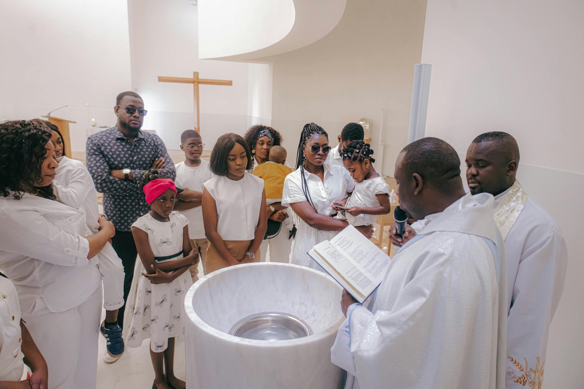 african family baptism ceremony in church