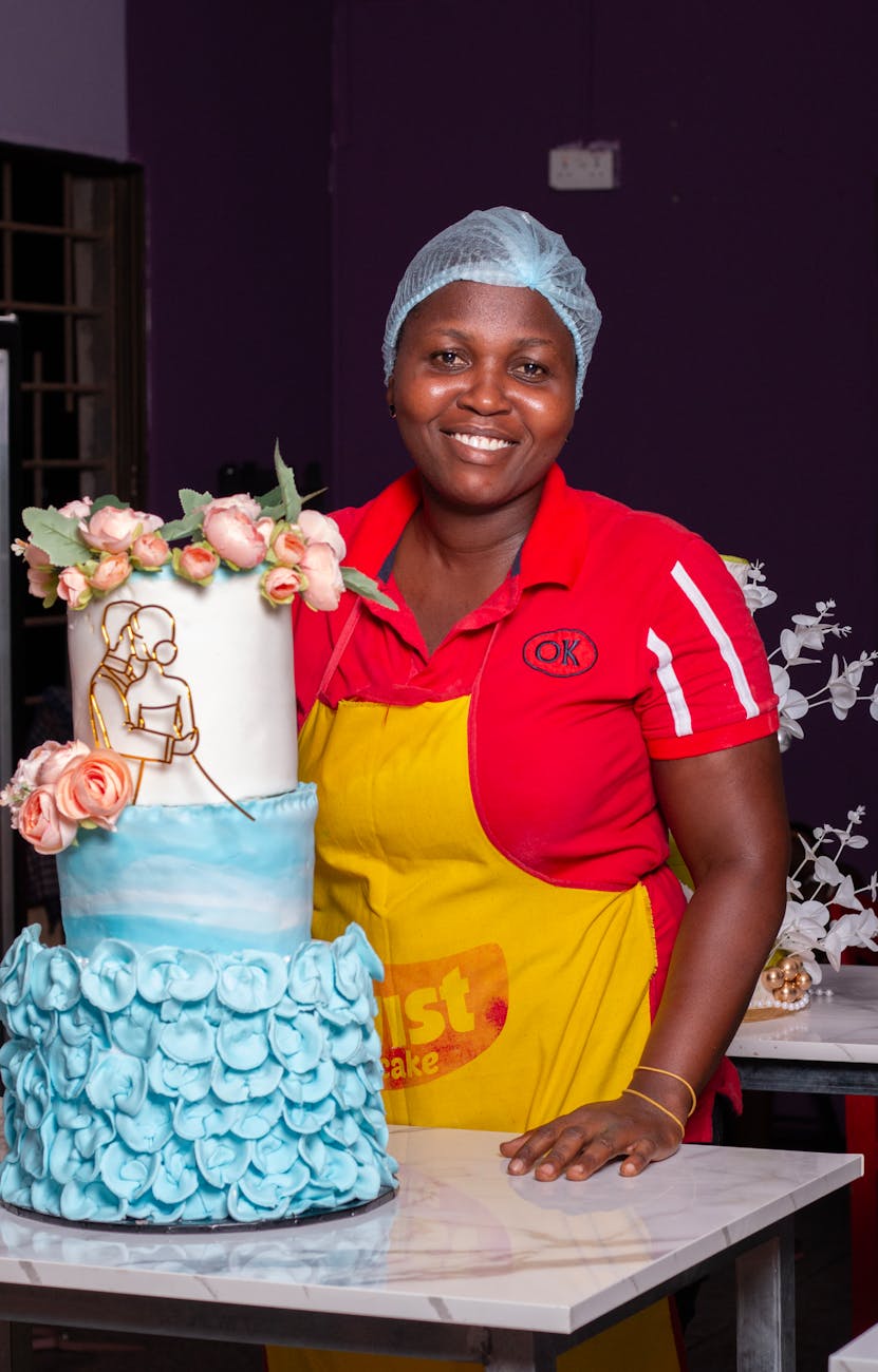 smiling baker with decorative birthday cake