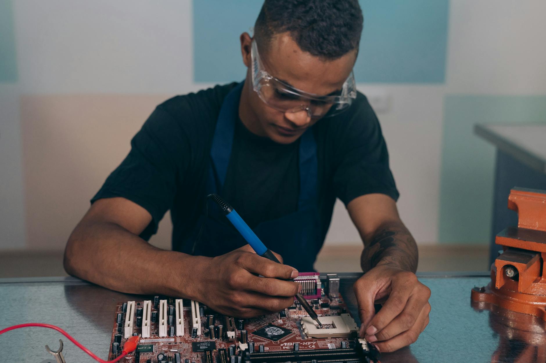 close up of a man fixing electronic
